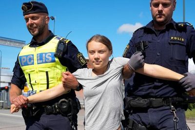 Defiant Greta Thunberg removed by police after new roadblock at oil terminal