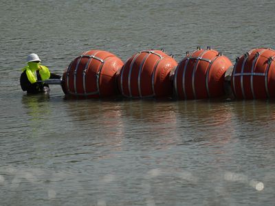 Justice Department sues Texas after Gov. Abbott refuses to remove floating barrier