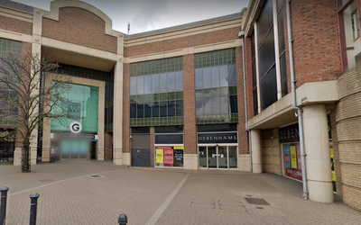 Woman falls from balcony at Glades shopping centre and lands on pensioner in her 80s