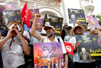 Tunisians protest president's expanding powers and demand release of all jailed political opponents