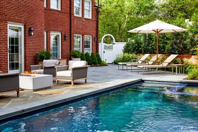This small backyard has a clever idea that elevates its pool and turns it into a sensory garden all at once