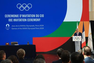 Olympic president invokes John Lennon's memory as Paris marks 1-year countdown to war-clouded Games