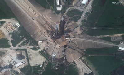 SpaceX Falcon Heavy seen from space waiting on launch pad (photos)