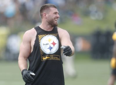 Check out Steelers LB T.J. Watt as he signs a baby at training camp