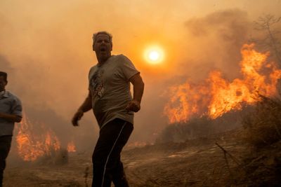 Greece fires – live: Rhodes state of emergency remains as flames reach outskirts of Athens