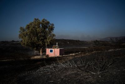 Exclusion zone set up around Greek military base after wildfires trigger powerful explosions