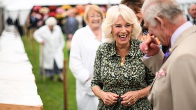 Queen Camilla and King Charles in fits of giggles as she jokes that pie 'looks just like my husband'