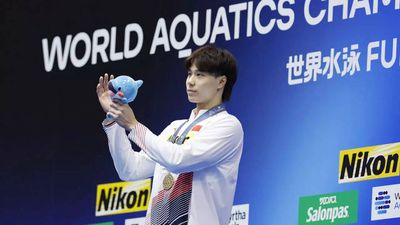 China's Qin Haiyang shatters record for breaststroke sweep at worlds
