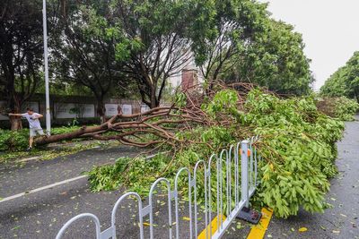 Typhoon Doksuri is downgraded to tropical storm status as it leaves southern China