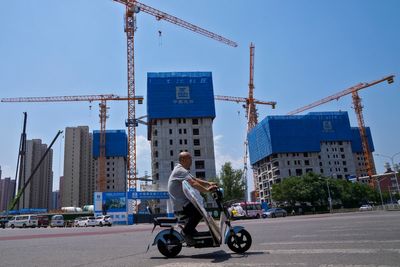 China factory activity shrinks in July, adding to pressure to reverse economic slump