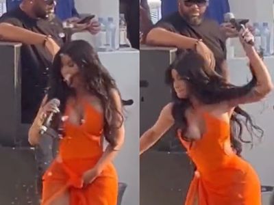 Furious Cardi B hurls microphone at fan who tossed drink at her during performance