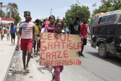 Haitians, weary of gang violence, protest the kidnapping of an American nurse and her daughter