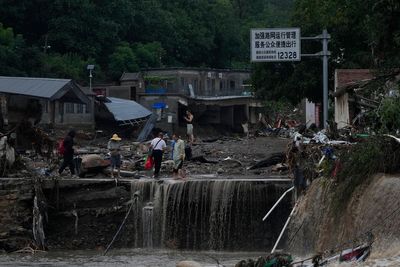 11 dead and 27 missing in flooding around Beijing after days of rain, Chinese state media report