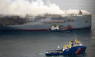 Burning ship carrying 3,000 cars towed to new position off Dutch coast