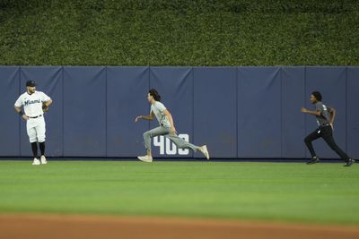 A fan on the field evaded security to make a daring escape during the Phillies-Marlins game