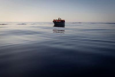 Greek authorities charge 2 migrants for destroying dinghy carrying 40 as rescue boat approached