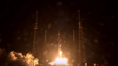 SpaceX launches communications satellite, lands rocket at sea