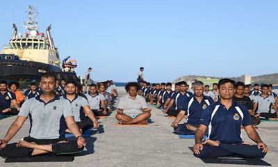 Indian Naval teams perform Yoga at Port Moresby harbour
