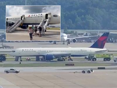 Plane-load of passengers evacuated from Delta flight after tyres burst into flames