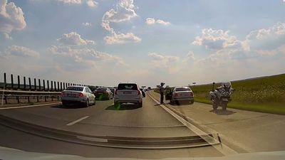 See Driver Passing Traffic Jam On Shoulder Get A Healthy Dose Of Instant Karma