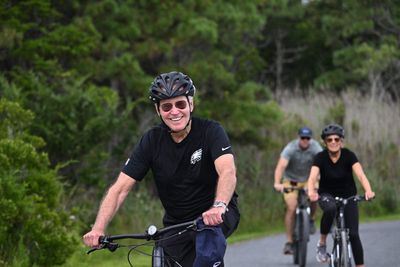 Biden gives very curt response to Trump arraignment question while biking