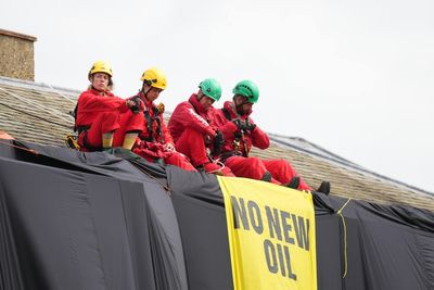 Greenpeace protesters bailed following roof-top protest at PM’s home
