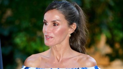 Queen Letizia of Spain’s sapphire blue and white bardot dress is giving us serious holiday outfit inspo!