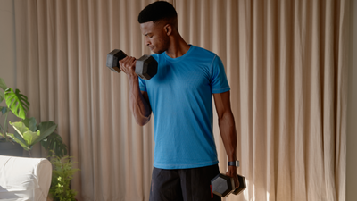 You only need two dumbbells and these four standing supersets to build bigger arms