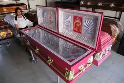 A funeral home in El Salvador offers pink coffins with Barbie linings