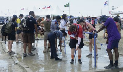 S. Korea presses on with World Scout Jamboree as heat forces thousands to leave early