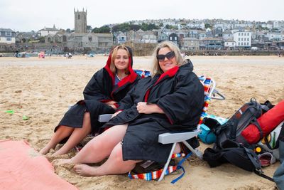 ‘It’s more February than August’: holidaymakers sit out storm in Cornwall