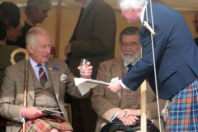 King Charles enjoys a wee dram at the Mey Highland Games