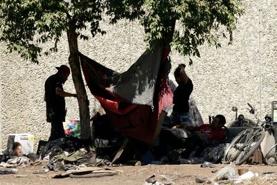Federal judge says California's capital city can't clear homeless camps during extreme heat