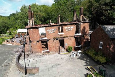 Remains of landmark pub demolished two days after it was gutted by fire