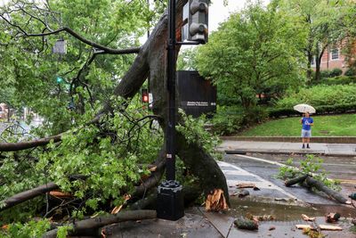 Powerful storms killed 2 people and left more than 1 million customers without power