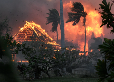 Hawaii wildfires burn homes and force evacuations, while strong winds complicate the fight