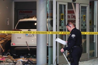 Vehicle strikes 3, fatally injuring 1 in service area of Los Angeles car dealership, official says