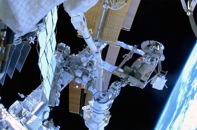 Russian cosmonaut becomes first to ride European robotic arm on ISS spacewalk