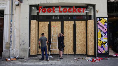 Three French police officers charged over man's death during riots