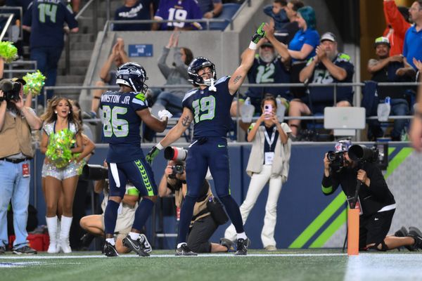 Seahawks WR Easop Winston giving touchdown ball to his mom