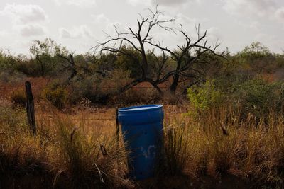 Barrels of drinking water for migrants walking through Texas have disappeared