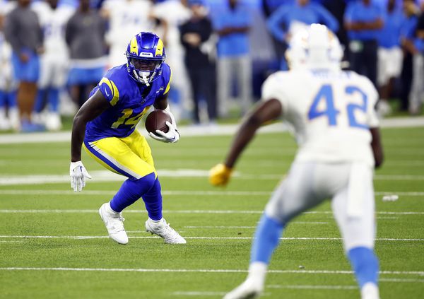 Los Angeles Rams wide receiver Tyler Johnson (14) reaches for the pass  while being held by Los Angeles Chargers cornerback AJ Uzodinma (35) in a  NFL preseason game. The Chargers defeated the