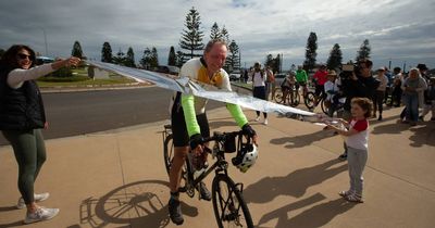 Bob Sheridan cycles home into Nobbys after a six month journey