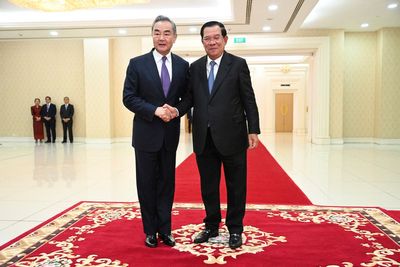 China's foreign minister visits Cambodia days after incumbent premier hands off the job to his son