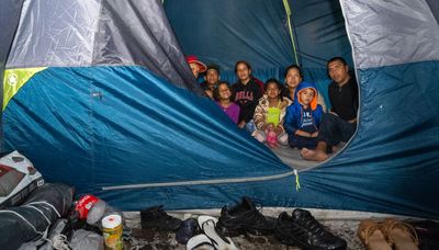 Migrant families kicked out of Rogers Park motel for missing curfew are sleeping in tents