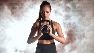 I did the standing dumbbell twist for a week — here’s what happened to my abs
