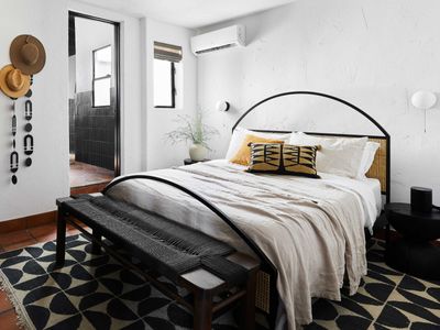 Designer Bobby Berk says we all need to "strip" our bed pillows for a better bedroom - we investigate