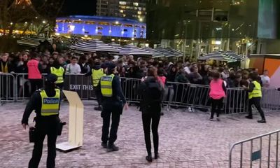 World Cup football fans barge through barricades to enter Federation Square fan zone