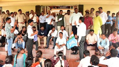Students stage protest against university for not putting up portraits of Mahatma Gandhi, Ambedkar during flag hoisting