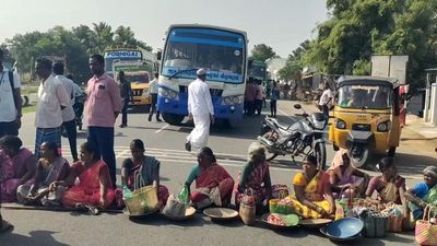 Workers employed under MGNREGA stage road roko in Tirupattur